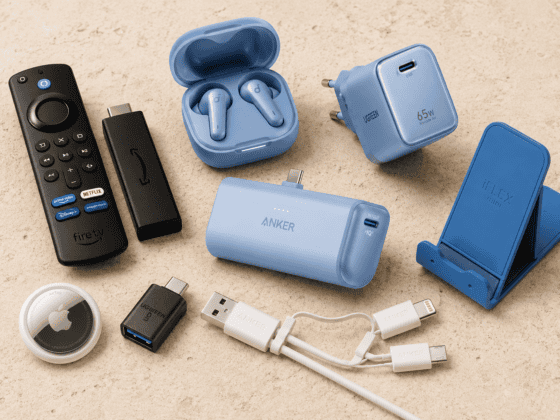 travel tech essentials including Fire TV Stick, portable charger, travel adapter and earbuds