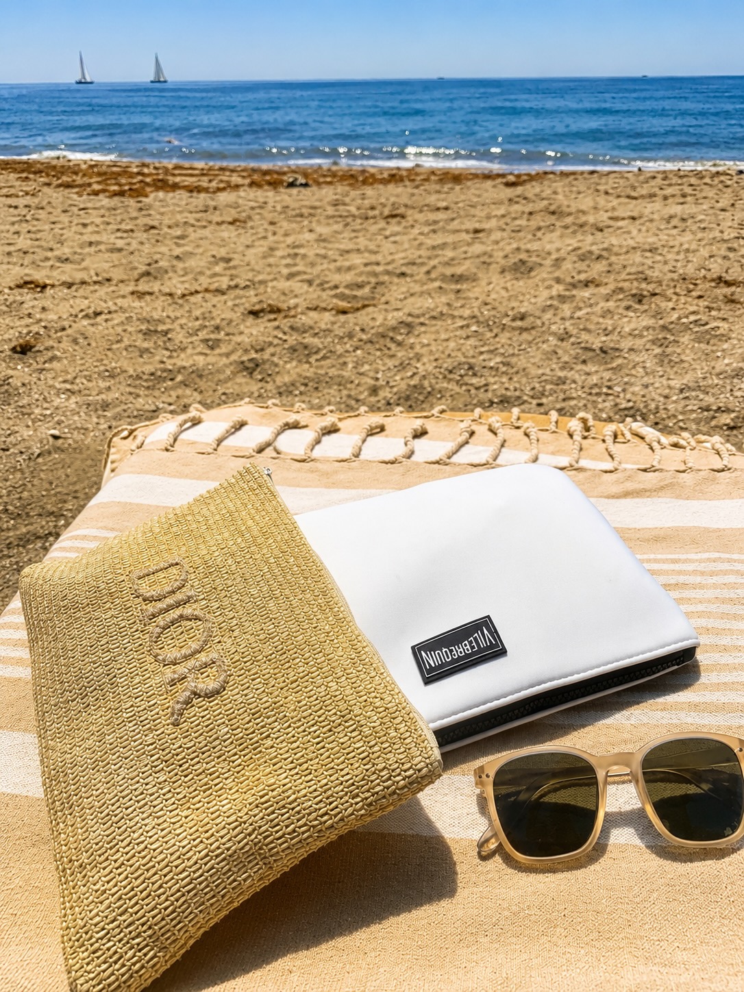 dior beauty pouch and villebrequin beach and pool